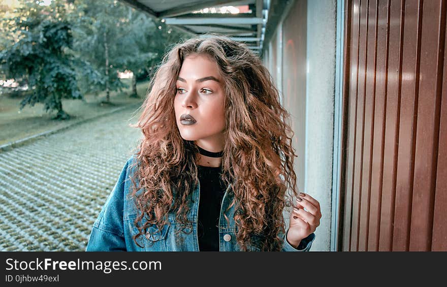 Women Wearing Blue Denim Jacket