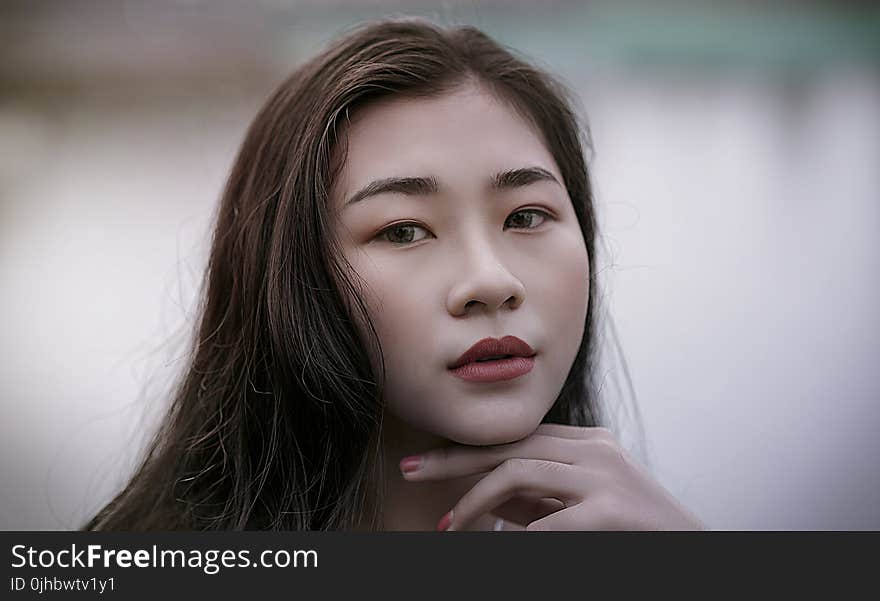 Close-Up Photography of a Woman With Red Lipstick Smiling