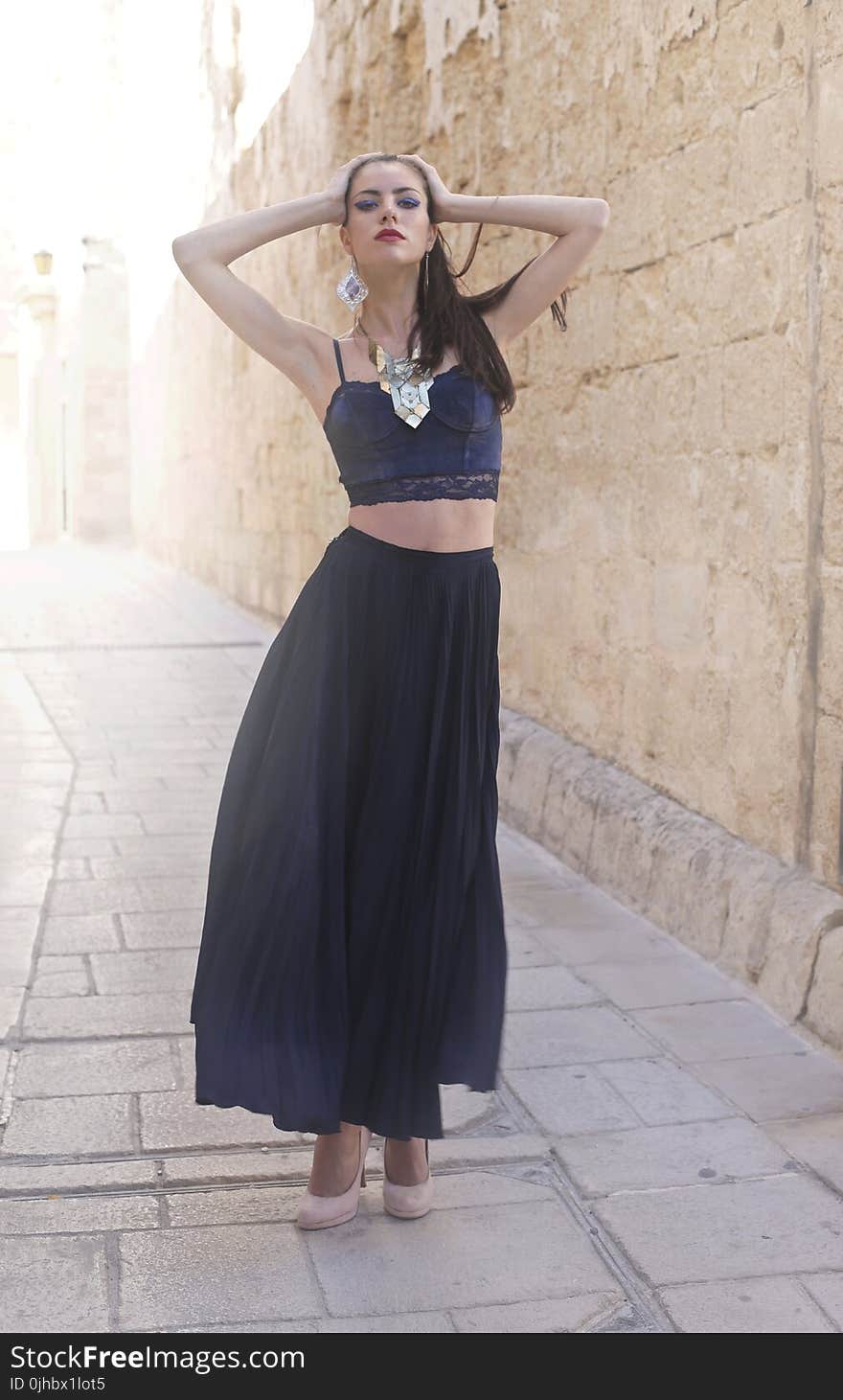 Photo of a Woman Wearing Black Dress