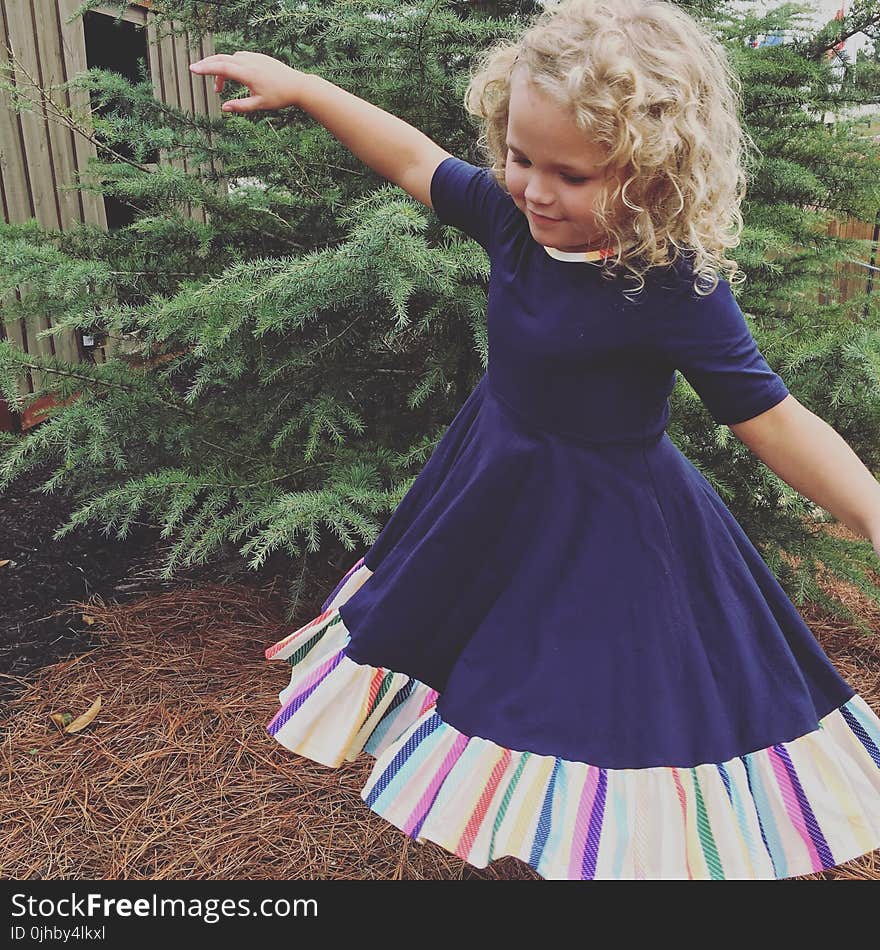 Photo of Girl Wearing Half-sleeved Dress Near Green Leaf Plant