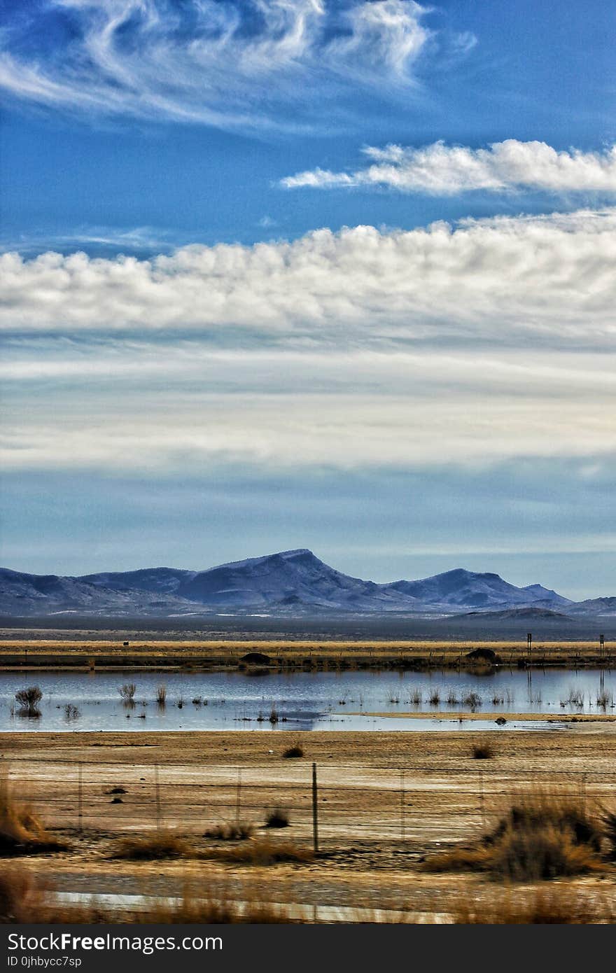 Mountains and Field at Daytime