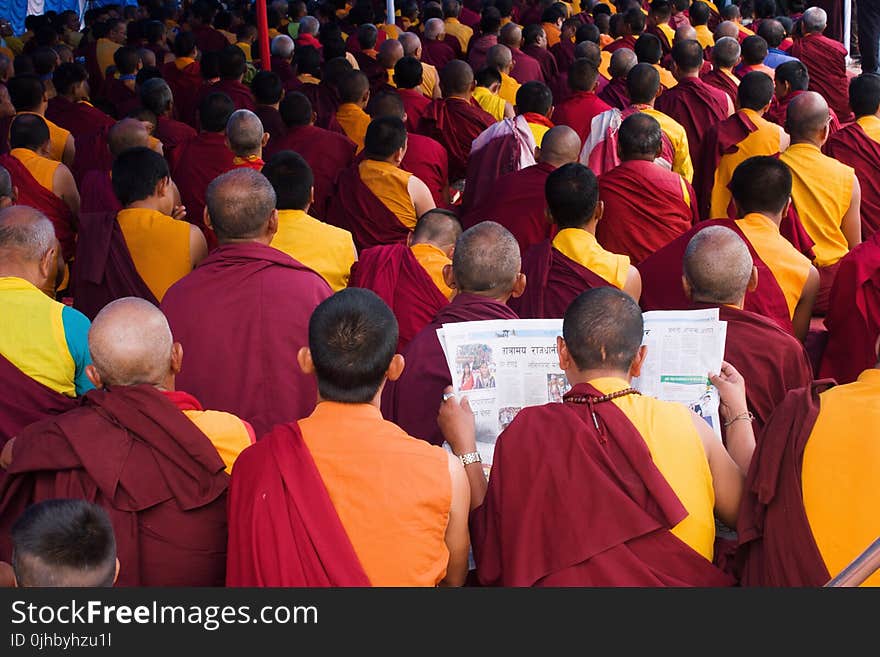 Group of Men Wearing Red and Yellow Shirt