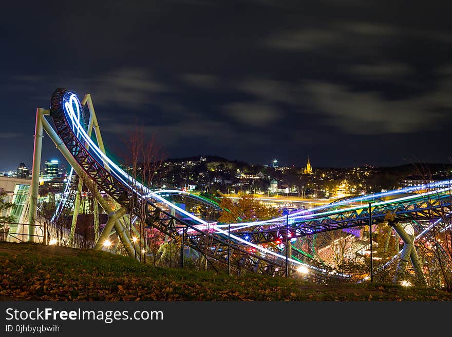 Time-lapse Photography Of Roller Coaster During Night Time