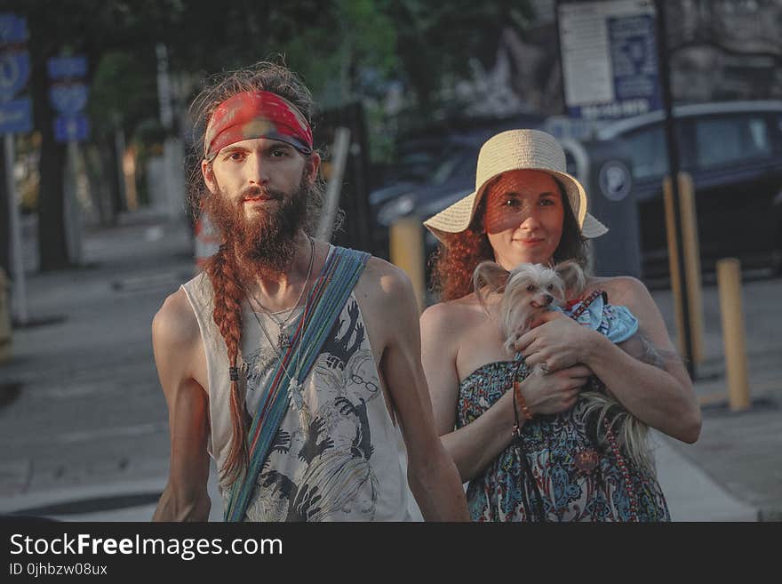 Man And Woman Standing On Sidewalk