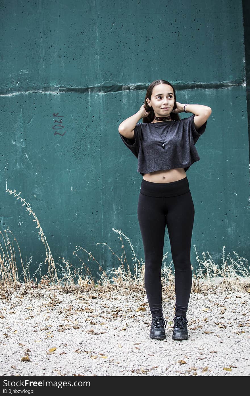 Woman Wearing Black Crew-neck Crop-top and Black High-waist Fitted Leggings