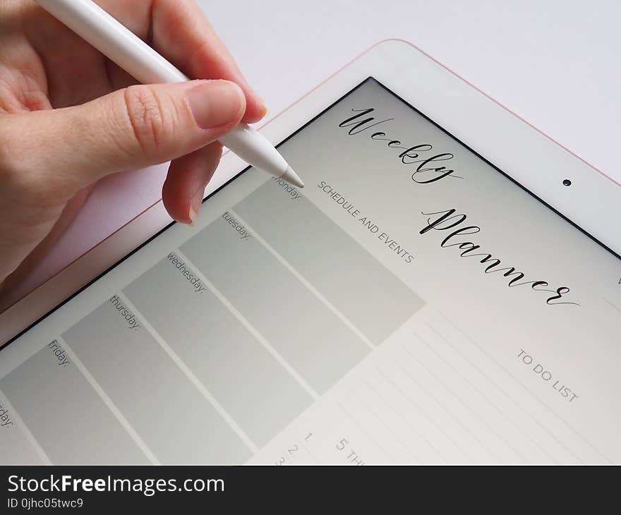 Person Holding White Stylus