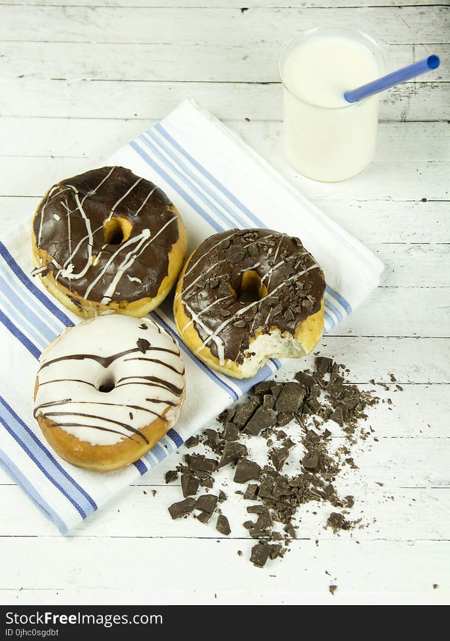 Three Assorted Donuts With Milk