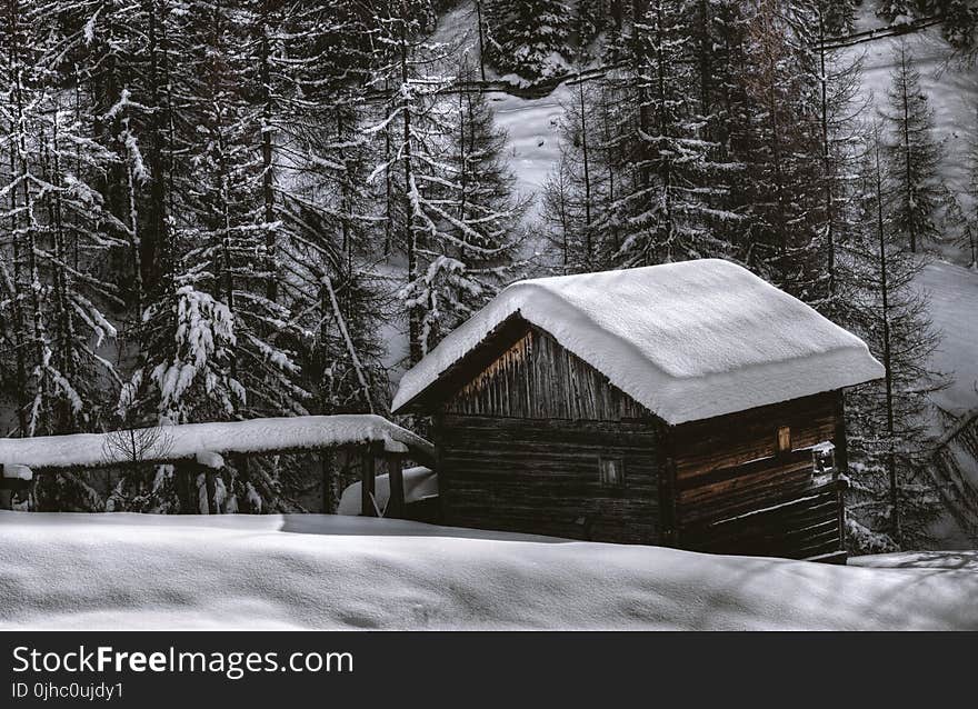 Brown Wooden Barn during Snow