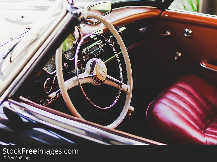 Photography of Red Leather Vehicle Interior