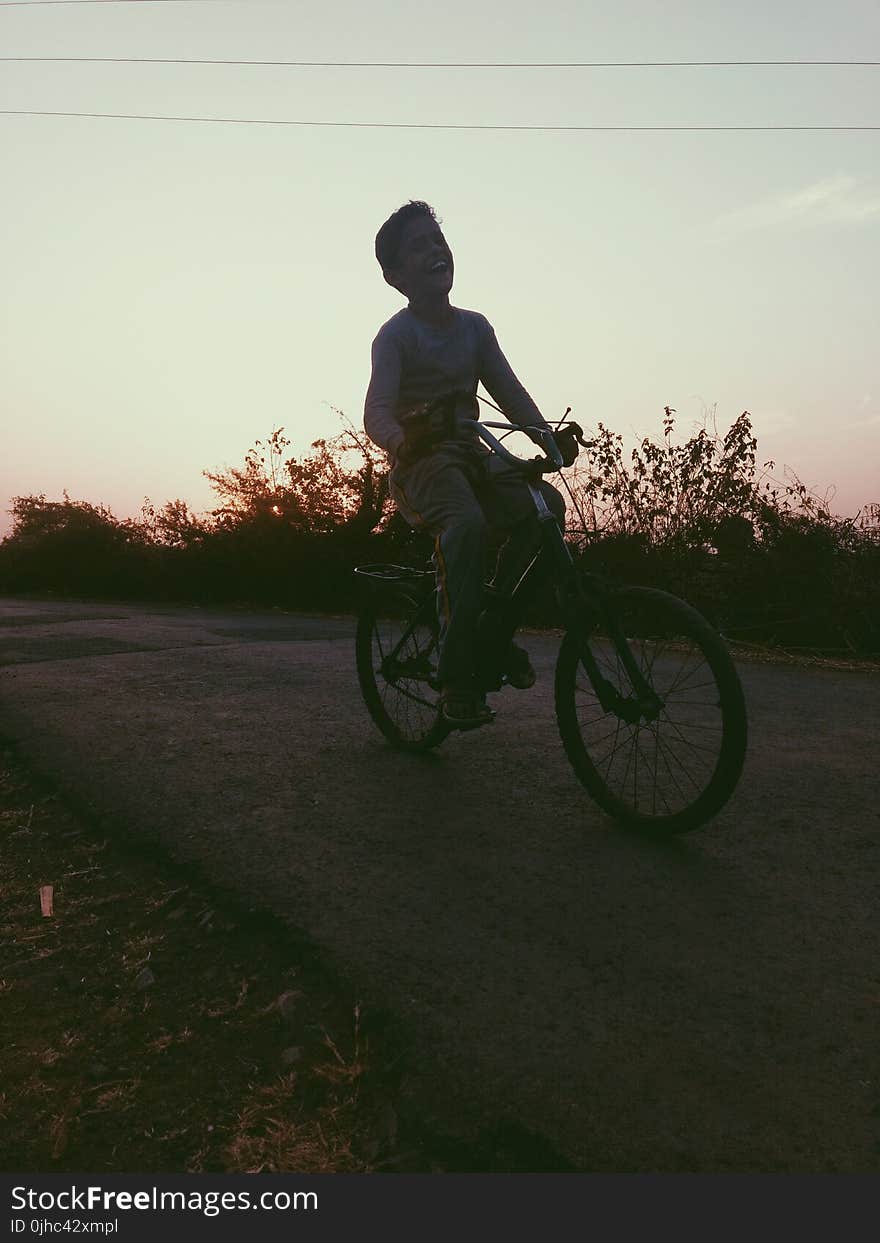 Boy Riding of Bicycle