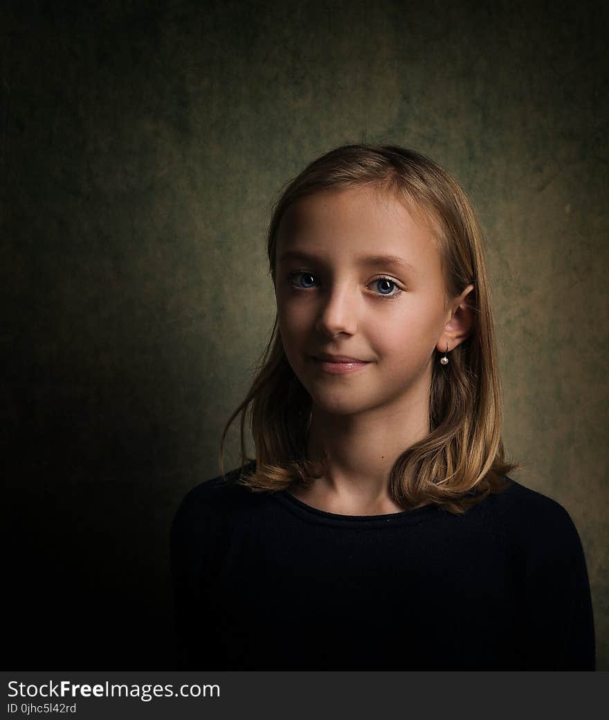 Smiling Girl With Blonde Hair Wearing Black Crew-neck Shirt