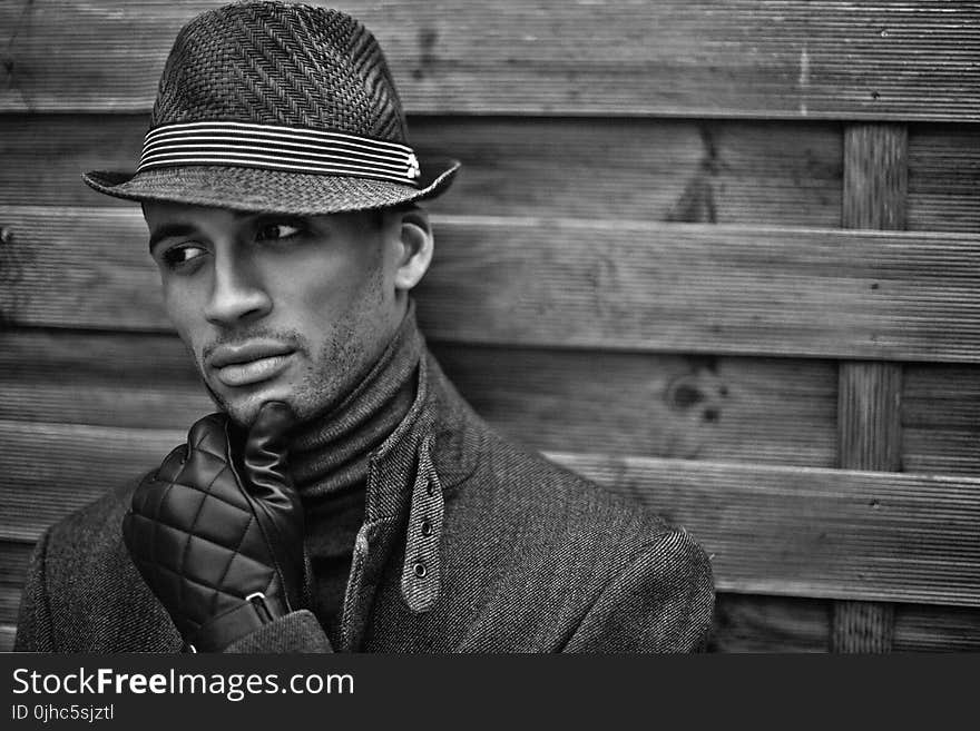 Man Wearing Black Hat and Gloves