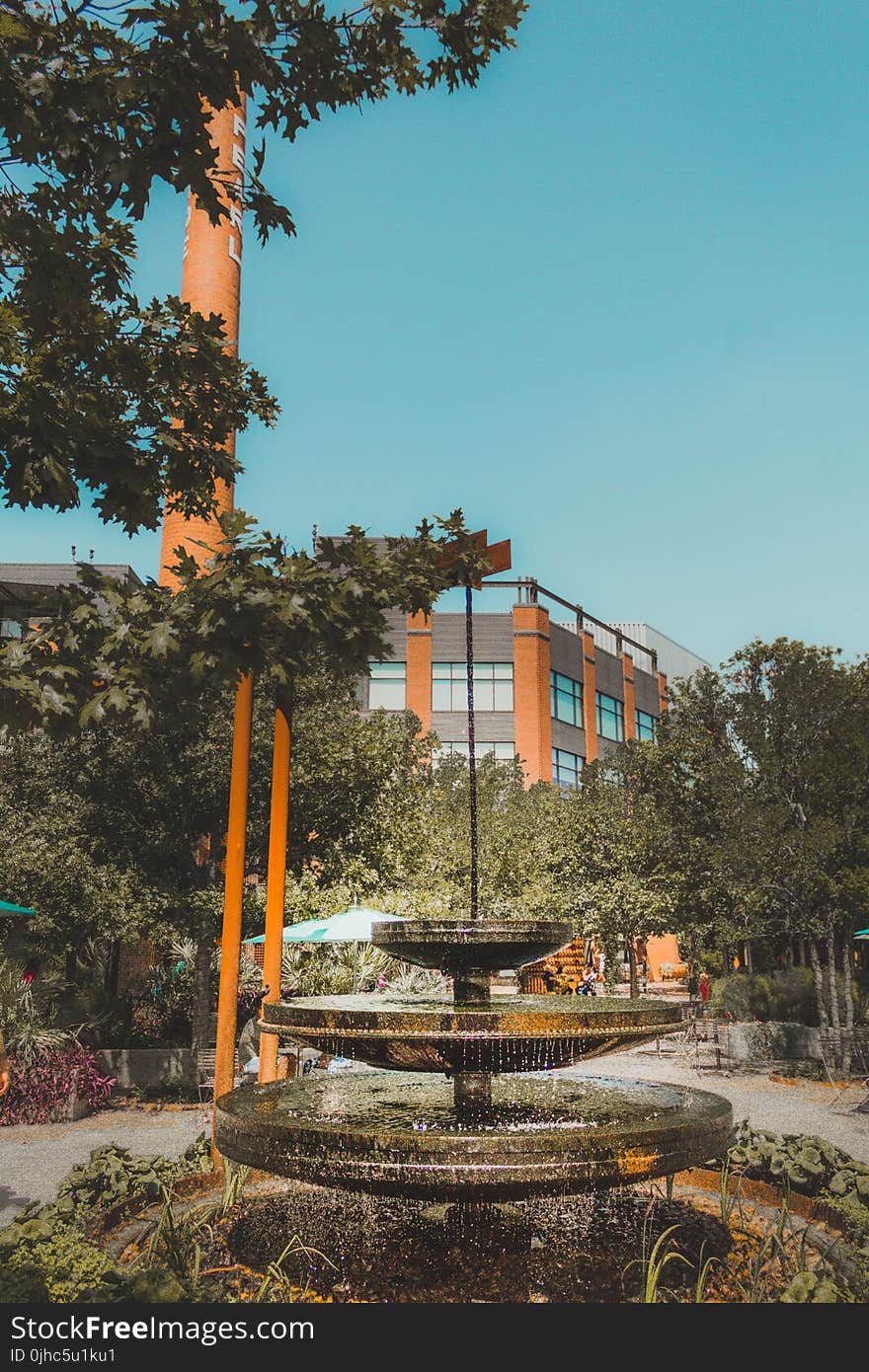 Black Concrete Water Fountain Under Blue Sky