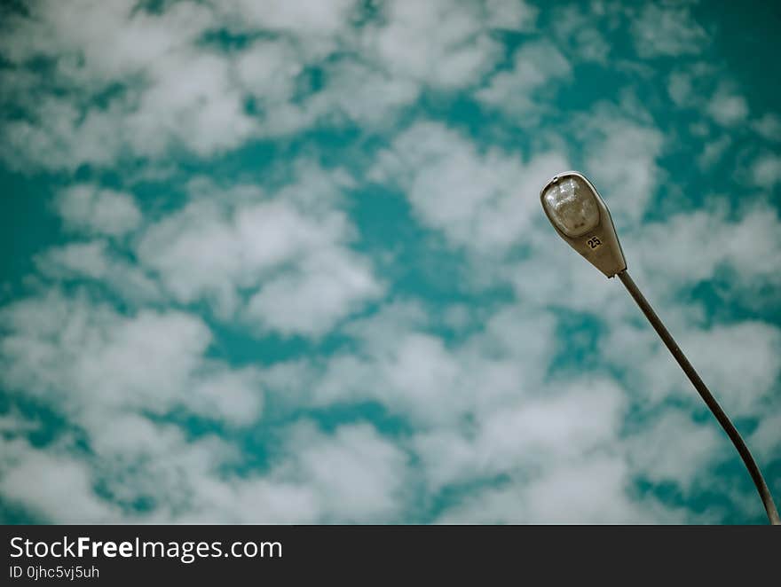 Grey Street Light Under Blue Sky With White Clouds