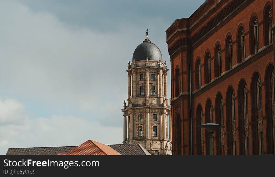 Brown and Black Concrete Capitol in Portrait Photography