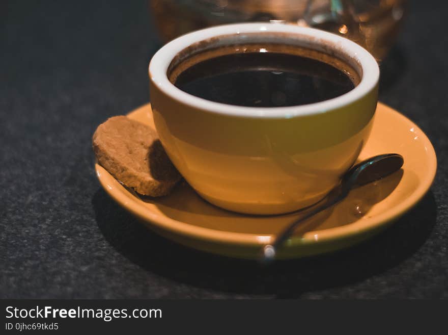 Coffee Filled Ceramic Teacup With Saucer