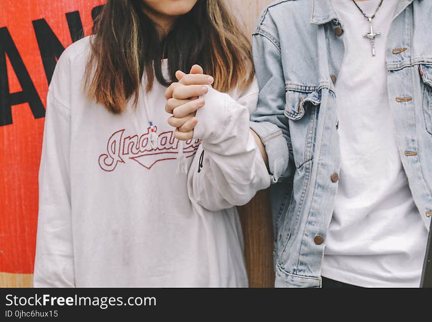 Woman Holding Man&#x27;s Hand During Day