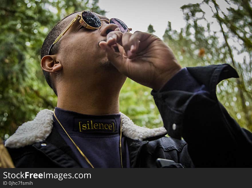 Photography of a Man Wearing Steampunk Sunglasses