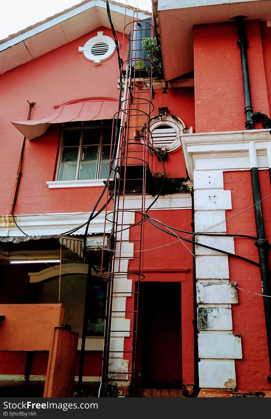 Photo of White and Red Concrete House