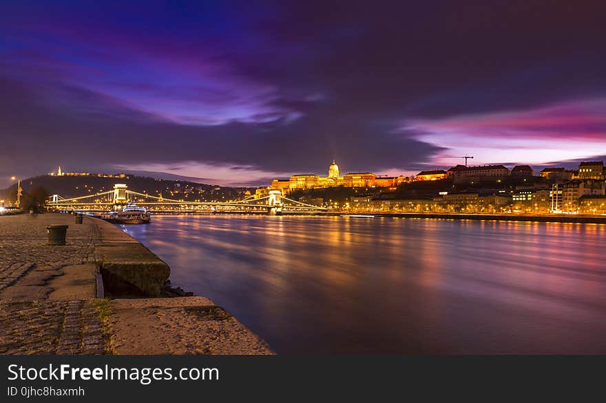 Town Near River During Night Time