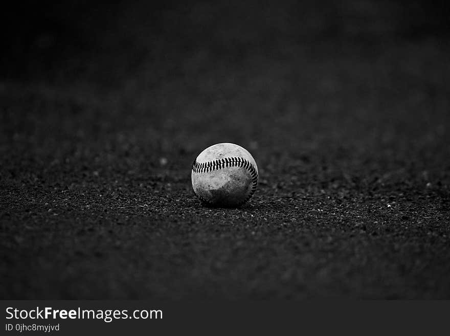 Selective Focus Grayscale Photography of Baseball