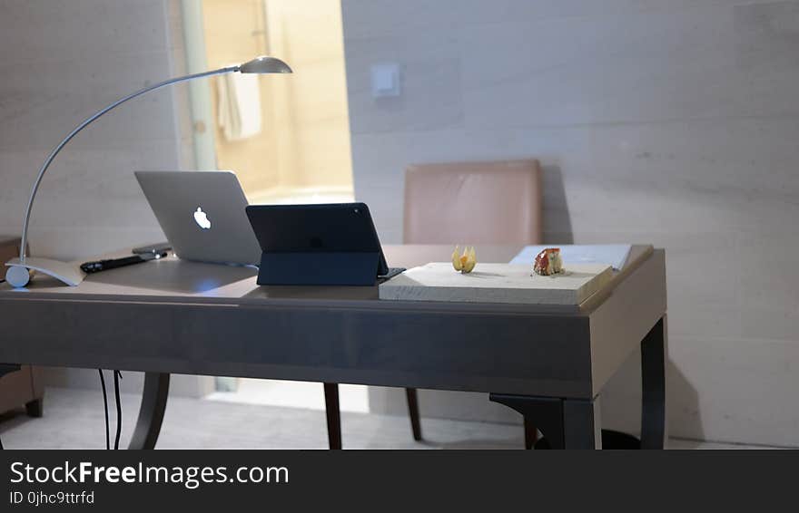 Silver Macbook on Gray Table