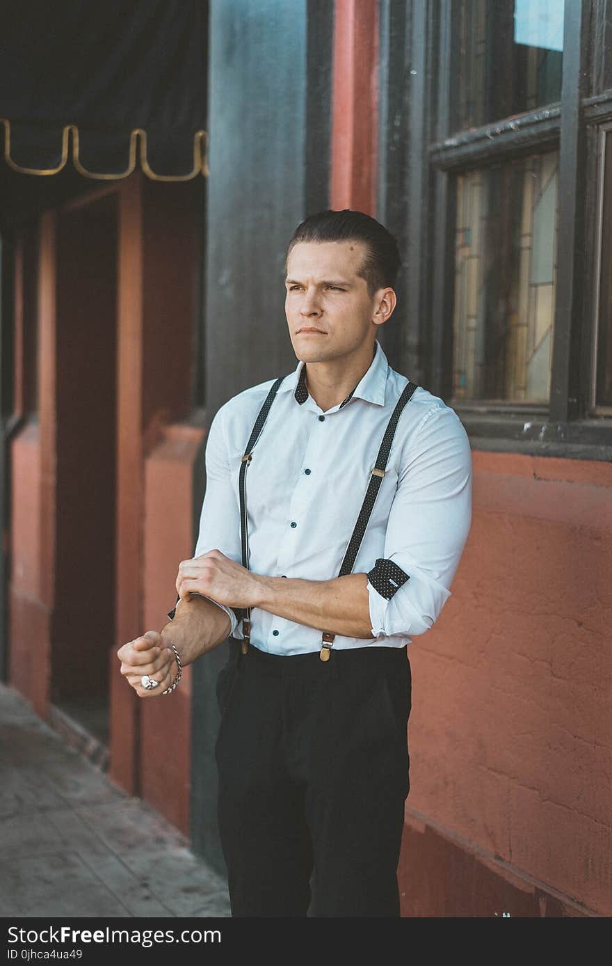 Man Wearing Teal Dress Shirt With Black Pants