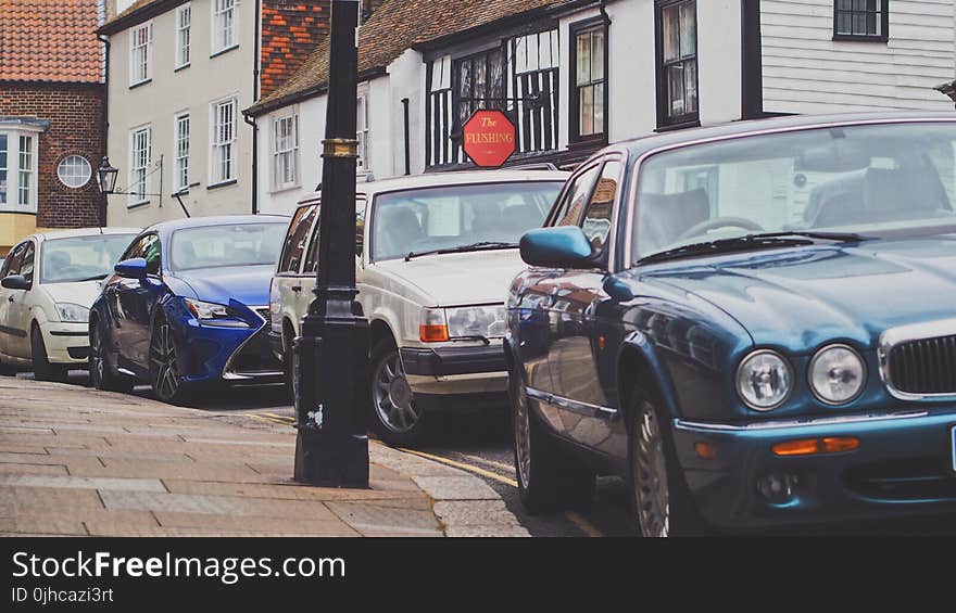 Four Car Parked Beside the Road