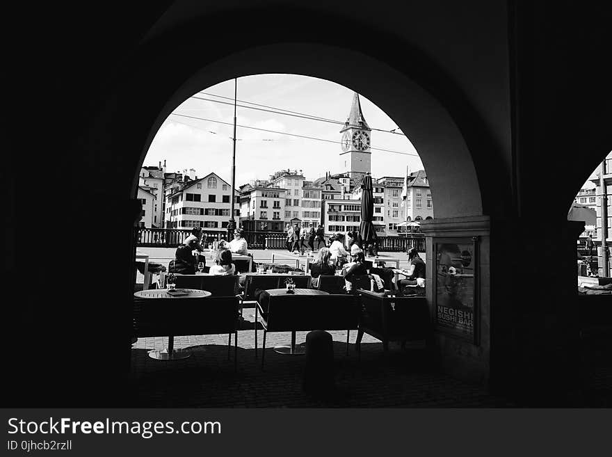 Grayscale Photo Of People In A Cafe