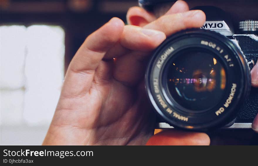 Person Holding Olympus Milc Camera