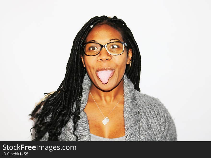 Photography of Woman Showing Her Tongue