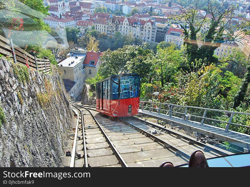 Aerial Photography of Red and Black Train With Village View