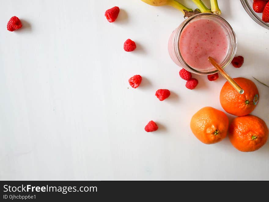 Orange Fruit And Raspberries