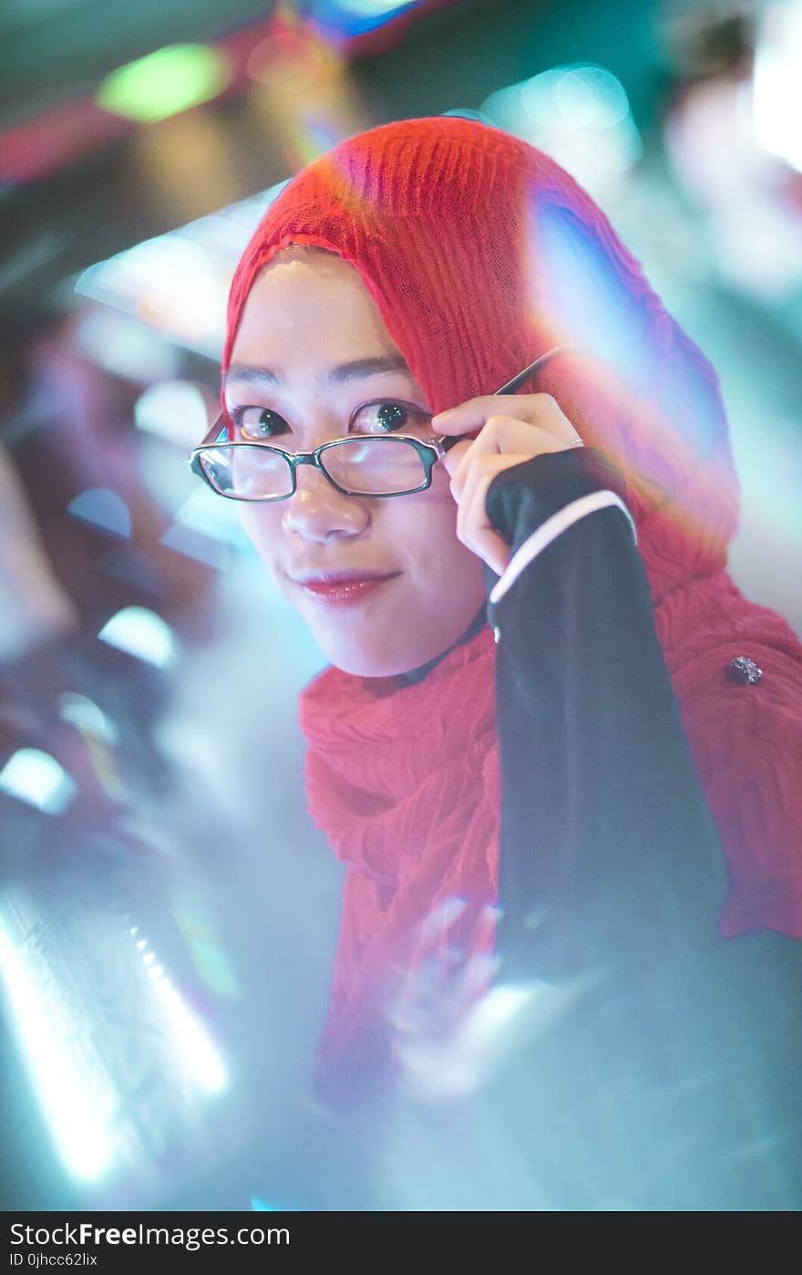 Woman Holding Her Black Framed Eyeglasses