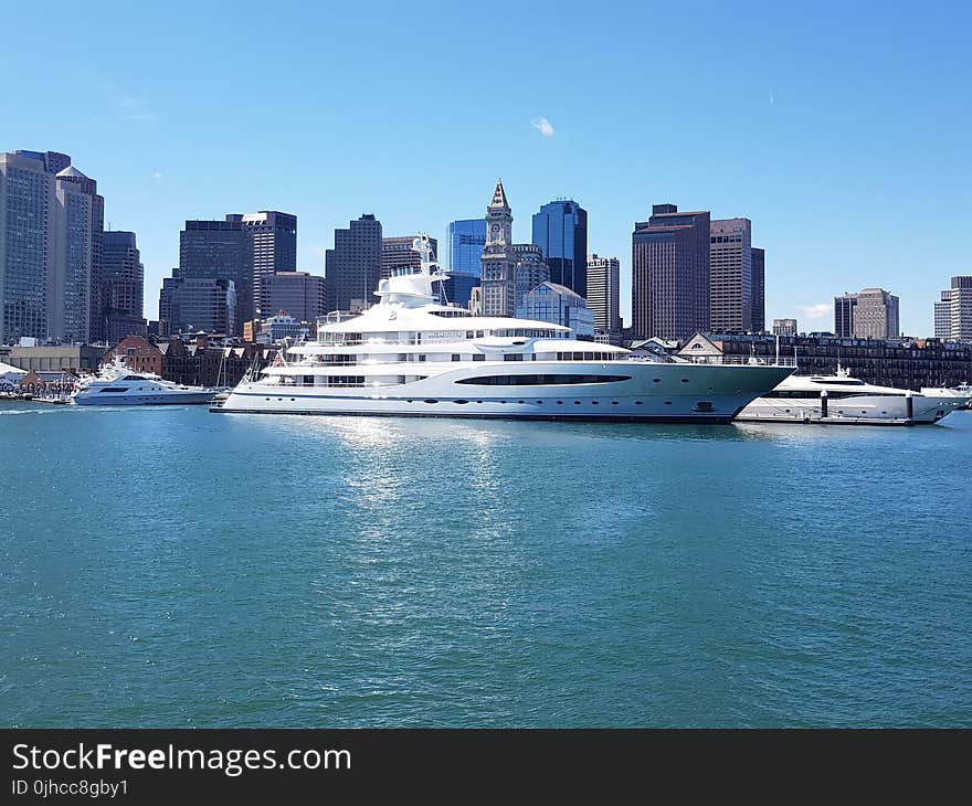 White Ship in a Distance of Skyline Buildings