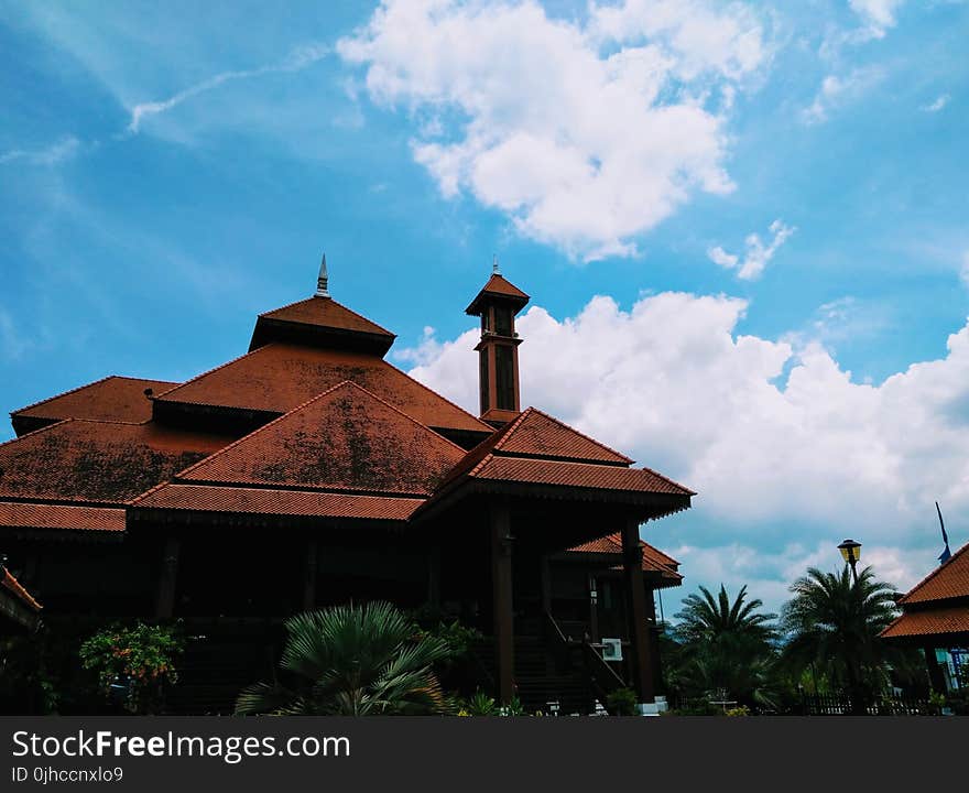 Low Angle Photography of Brown Concrete Building