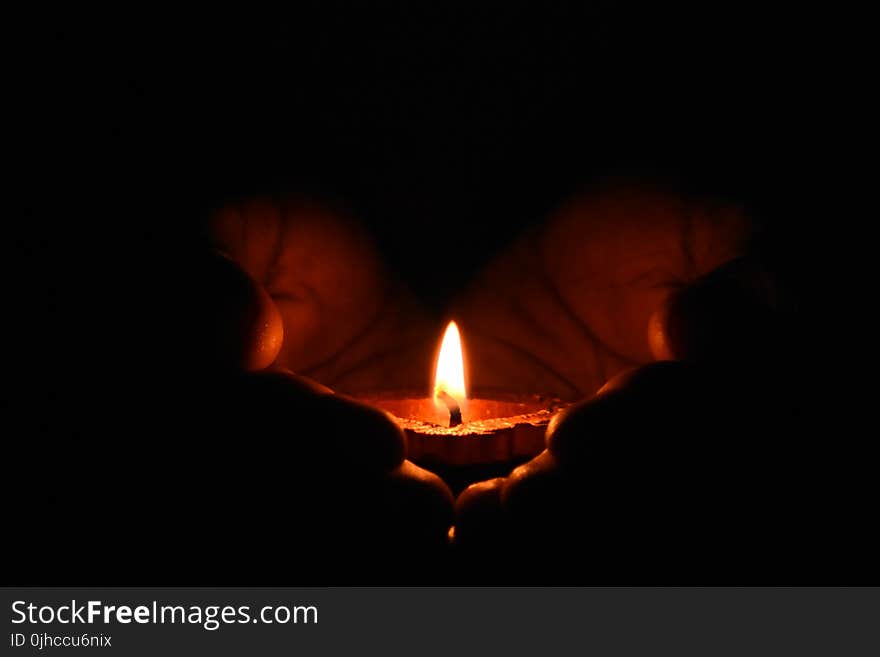 Tealight Candle on Human Palms