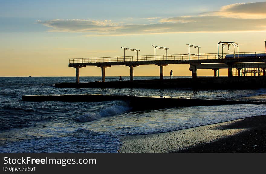 Silhouette Of Pier