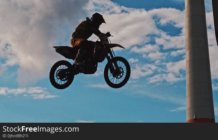 Man Riding Motocross Dirt Bike