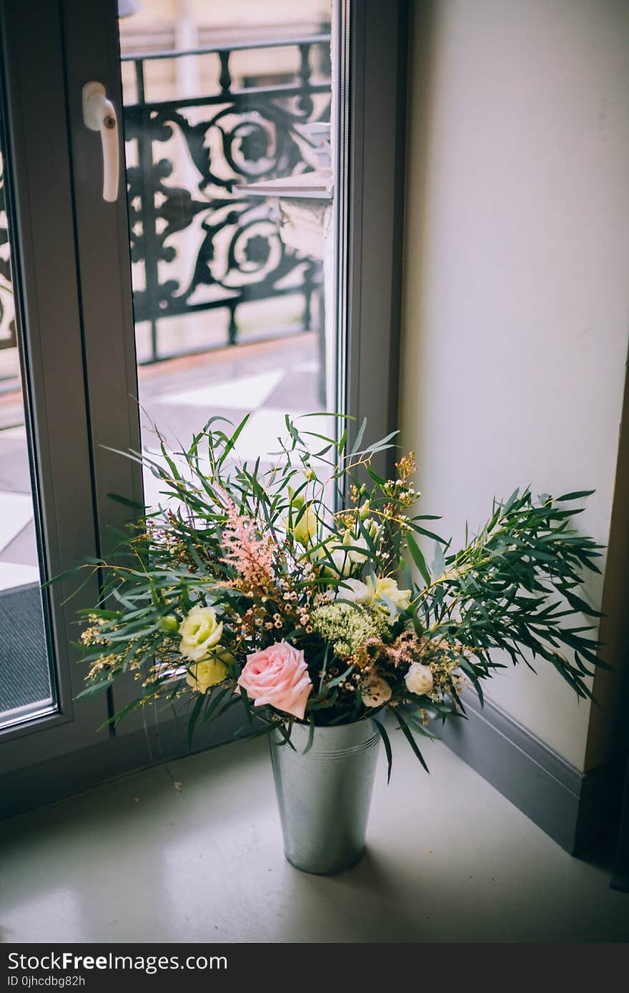 Photography of Bouquet of Flowers in Gray Vase