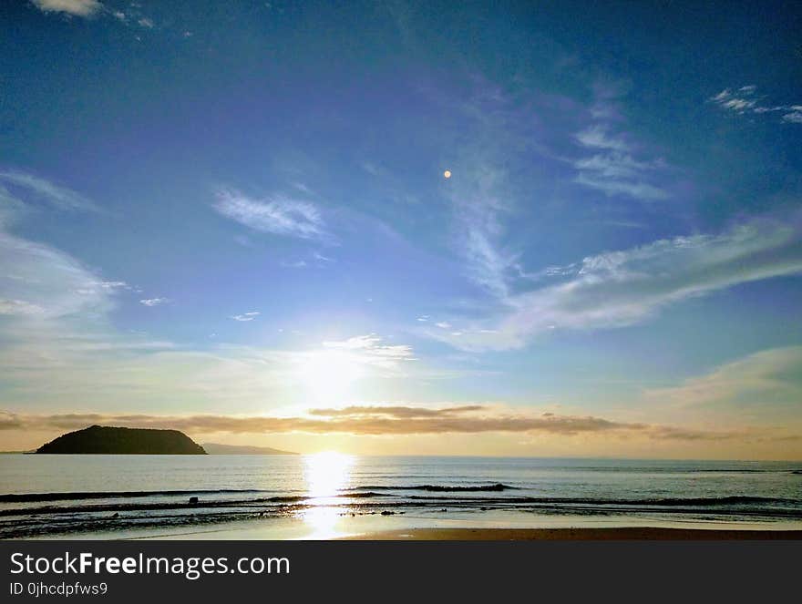 Panoramic Photography of Beach With Sun