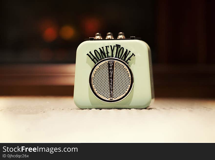 Selective Focus Photography of Honey Tone Mini Amp