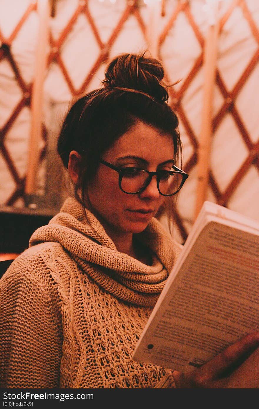 Photo of Woman Wearing Gray Scarf Reading Book