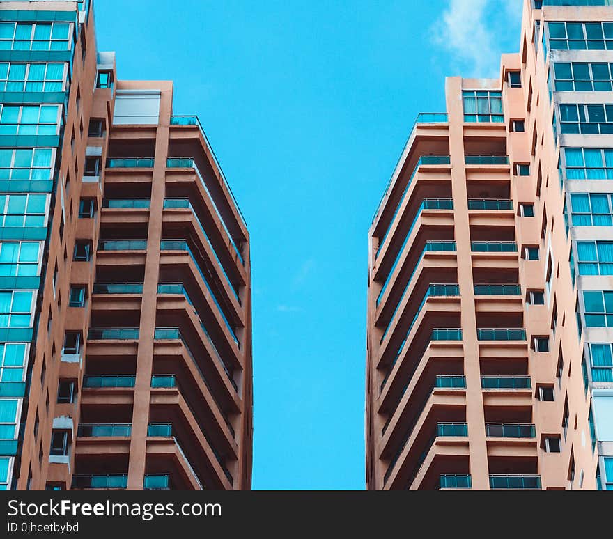 Low Angle View of Two High Rise Buildings Under Blue Sky