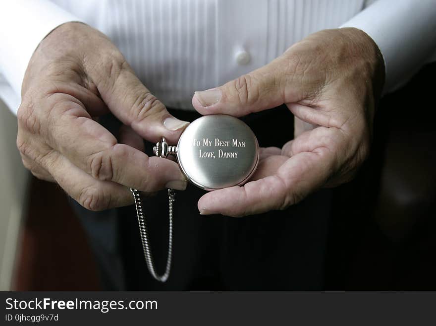 Person Holding Silver-colored Pocket Watch