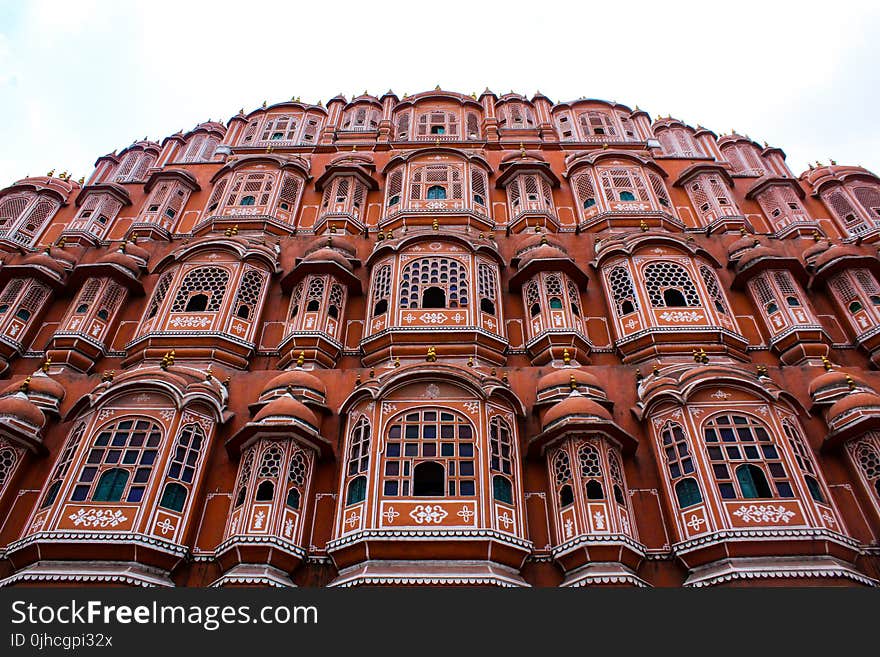 Low Angle Photography Of Brown Concrete Building