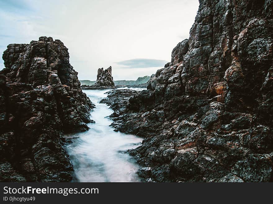 Massive Rock Formation In The Middle Of Ocean