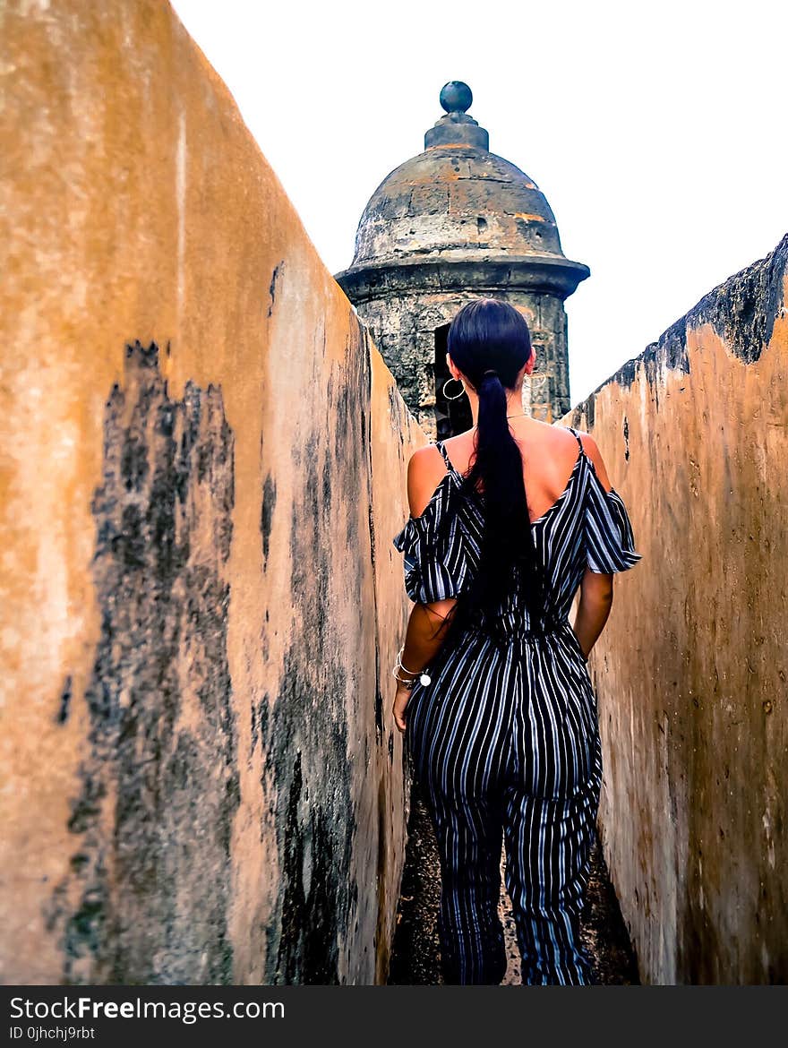 Woman Wearing Black and Gray Pinstripe Cold-shoulder Jumpsuit in Temple