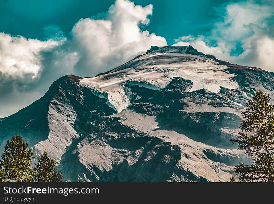 Rocky Mountain Under Blue Cloudy Sky