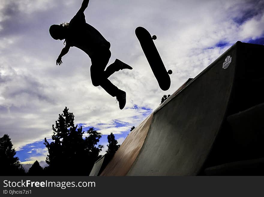 Silhouette Photo Of Person Doing Skateboard